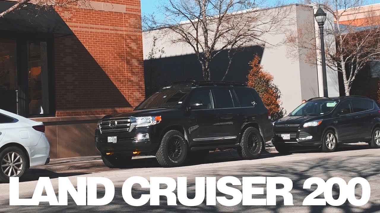 this is a video of a 200 series toyota land cruiser driving down the street