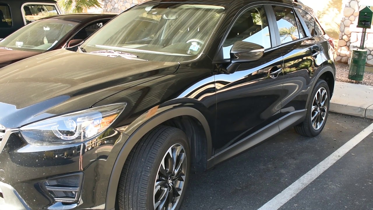 Car Repair: 2016 Mazda CX-5: Fuel Tank Release Button to Get to the Gas Cap.