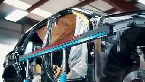 Porsche Cayenne body repair with frame machine by BODYMOTION Collision Center