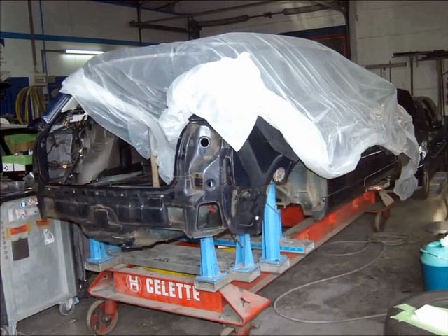 Audi A4 collision repair with Celette frame machine and dedicated Audi jigs